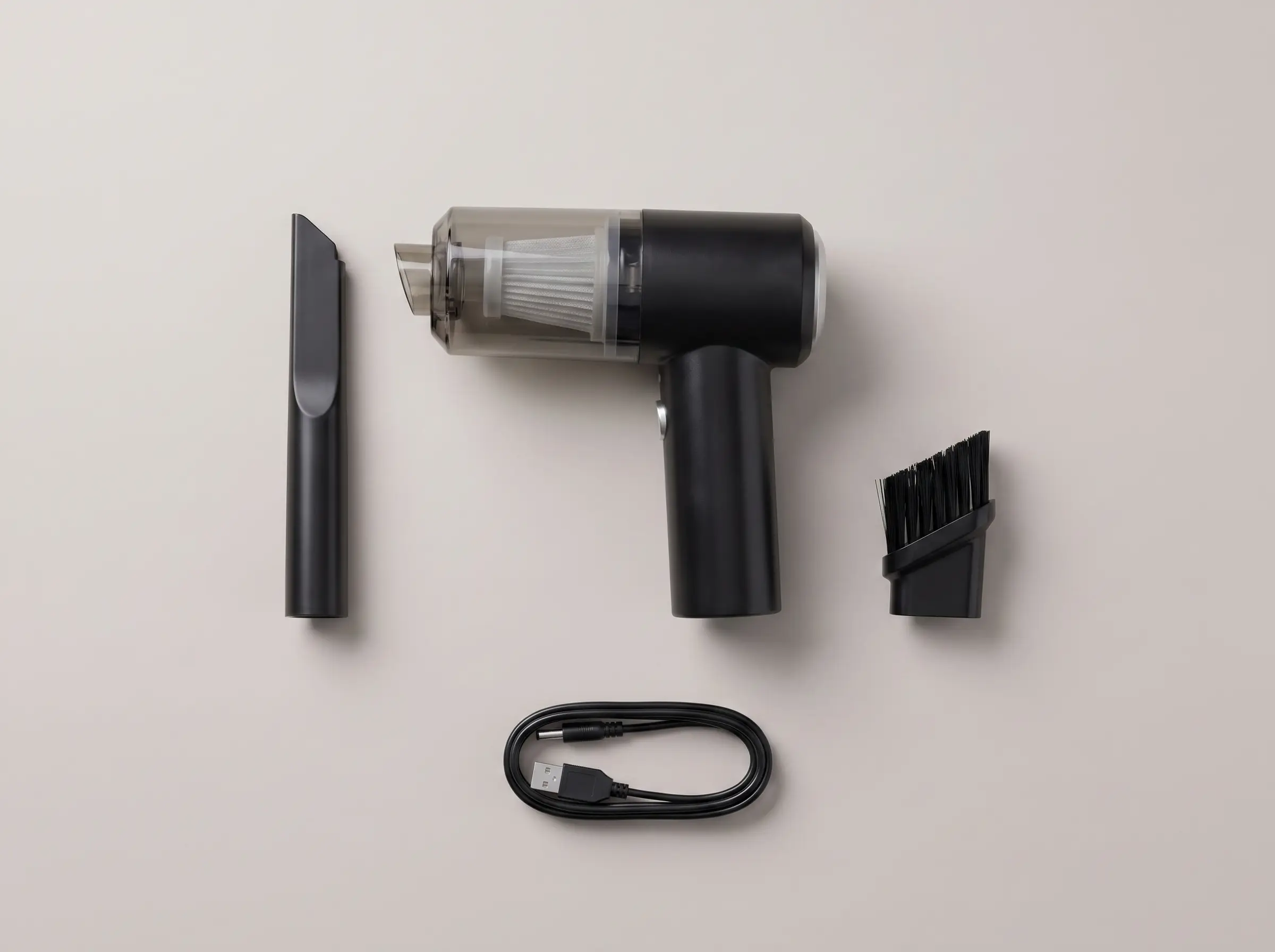 Kit completo visto de cima: aspirador, dois bocais e cabo USB